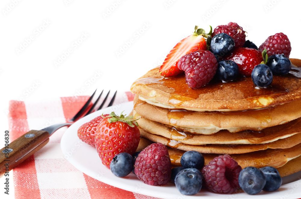 Pancakes with berries and honey over white Pancakes with berries and honey over white