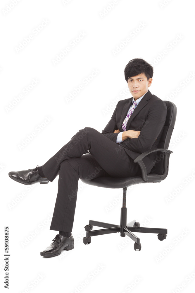 Young businessman sitting in a chair Young businessman sitting in a chair