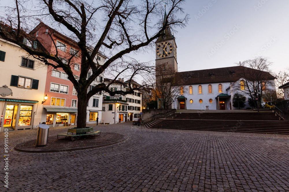 Fototapeta premium Illuminated Saint Peter Church in the Evening, Zurich, Switzerla