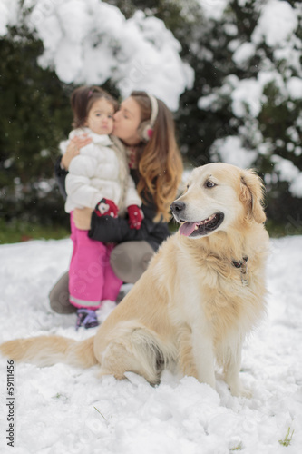 Family with a dog at winter