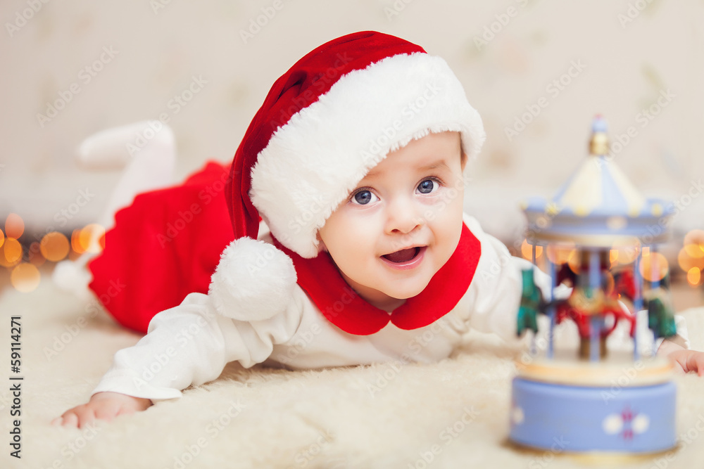 Cute baby in suit of Santa's little helper Cute baby in suit of Santa's little helper