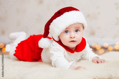 Cute baby in suit of Santa's little helper