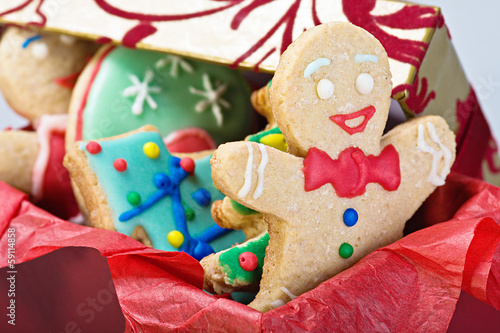 smiling gingerbread man cookies and the rest in a gift box