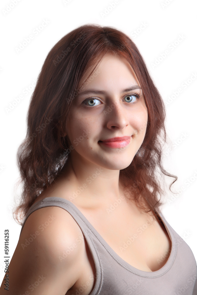 Redhead caucasian girl 18 years old in beige shirt, closeup.