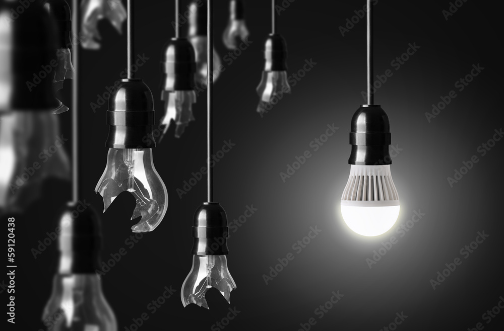 idea concept with broken bulbs and one LED glowing bulb idea concept with broken bulbs and one LED glowing bulb