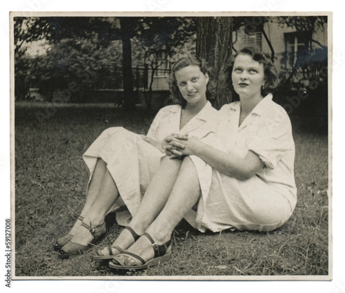 Two nurses on the lawn - circa 1950