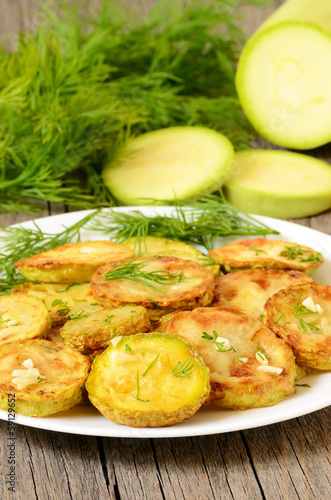 Fried zucchini with dill