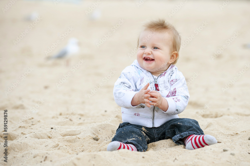 Little Kid on Sand Beach and Seagulls Little Kid on Sand Beach and Seagulls