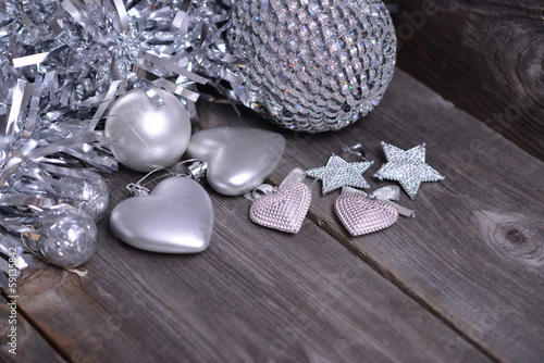 Christmas ornaments and gift ribbon on painted wood