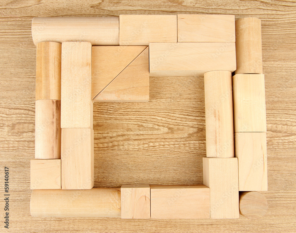 Wooden toy blocks on wooden background - obrazy, fototapety, plakaty 