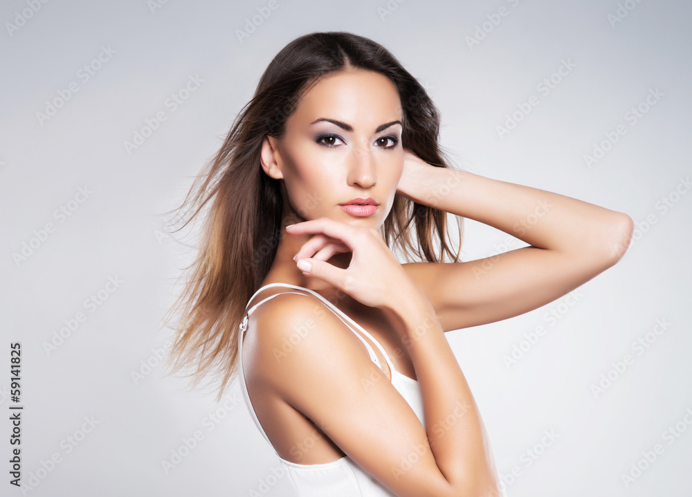 Naklejka premium Glamour portrait of a young and attractive woman in makeup