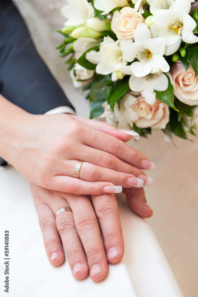 Hands of the groom and the bride with wedding rings Hands of the groom and the bride with wedding rings