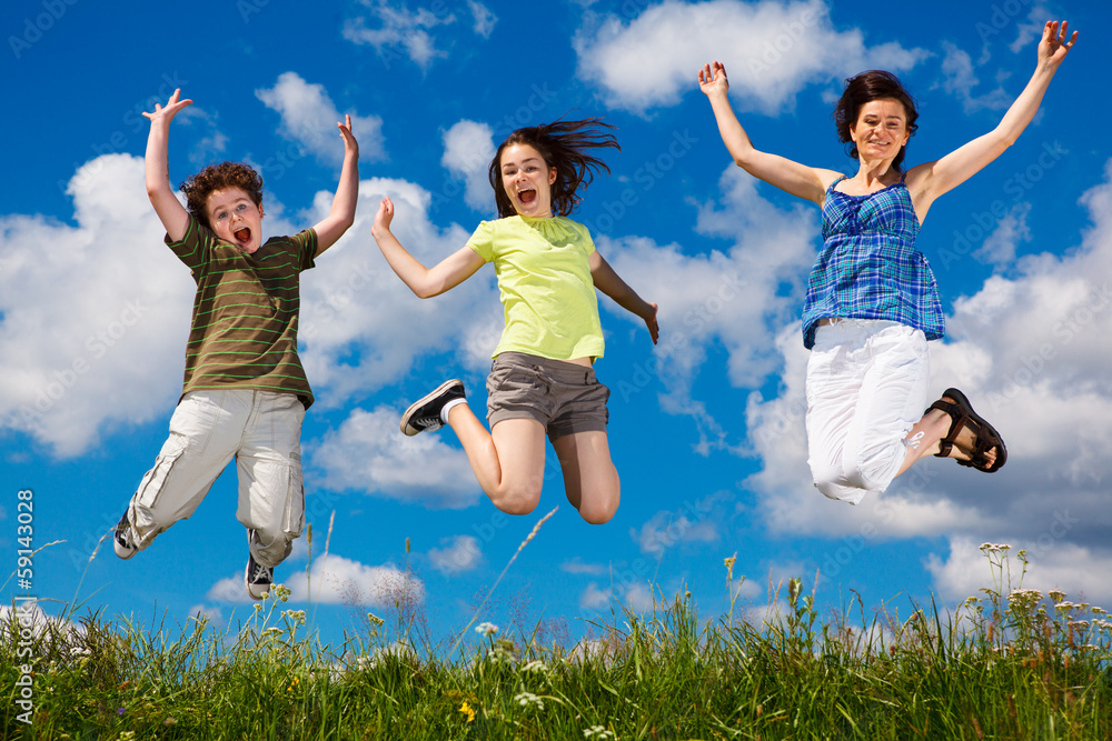 Active family - mother and kids running, jumping outdoor Active family - mother and kids running, jumping outdoor