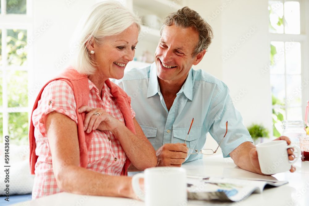 Middle Aged Woman Couple Magazine Over Breakfast Middle Aged Woman Couple Magazine Over Breakfast