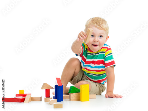 child boy playing  wooden toys