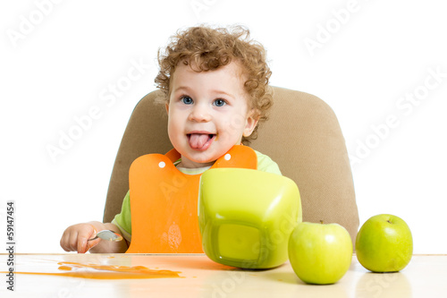 Bilde på lerret baby eating by himself
