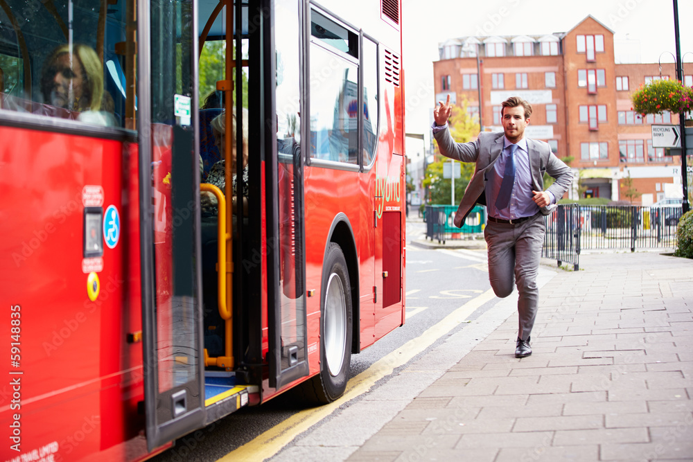 Foto Stock Businessman Running To Catch Bus Stop Adobe Stock