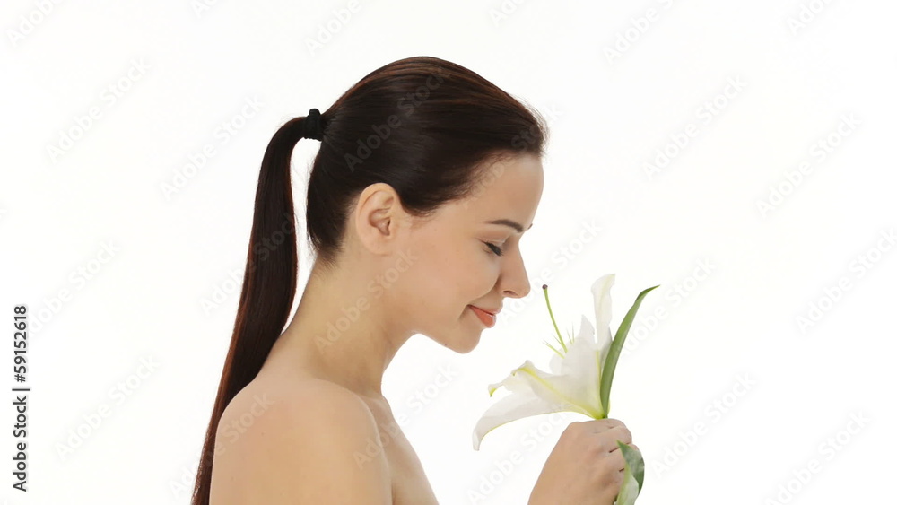 Portrait of beautiful young woman with health skin and with lily Portrait of beautiful young woman with health skin and with lily