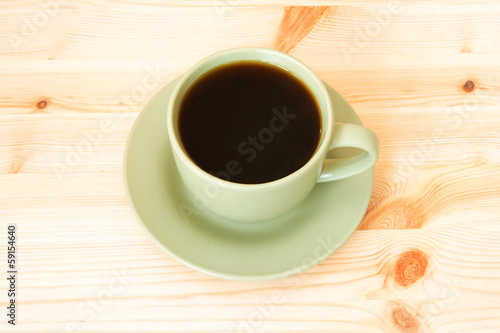cup of coffee isolated on a wooden background