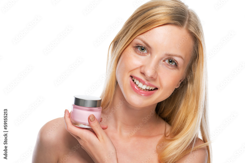 Portrait of happy teenage girl showing creme Portrait of happy teenage girl showing creme