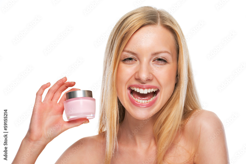 Portrait of smiling teenage girl showing creme Portrait of smiling teenage girl showing creme
