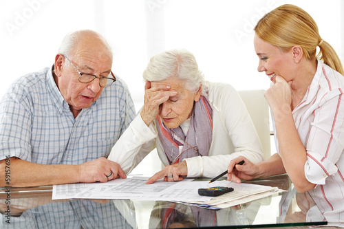 Senior couple with financial advisor