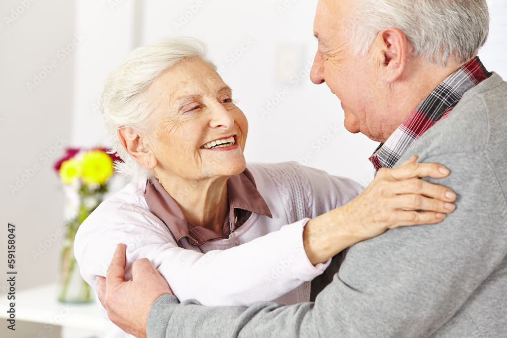 Two senior citizens dancing and smiling Two senior citizens dancing and smiling
