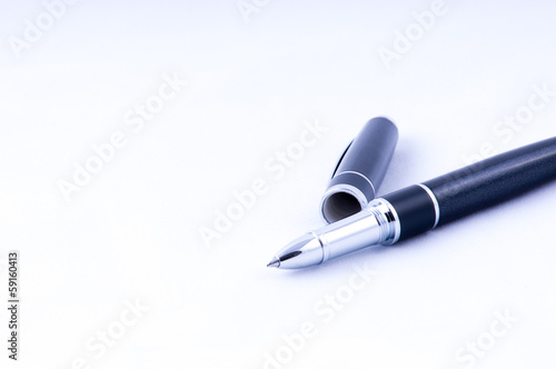 Black and silver pen with open cap closeup