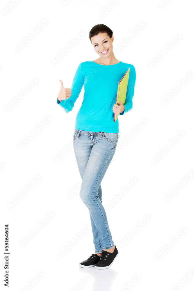 beautiful casual woman holding files and showing OK. beautiful casual woman holding files and showing OK.