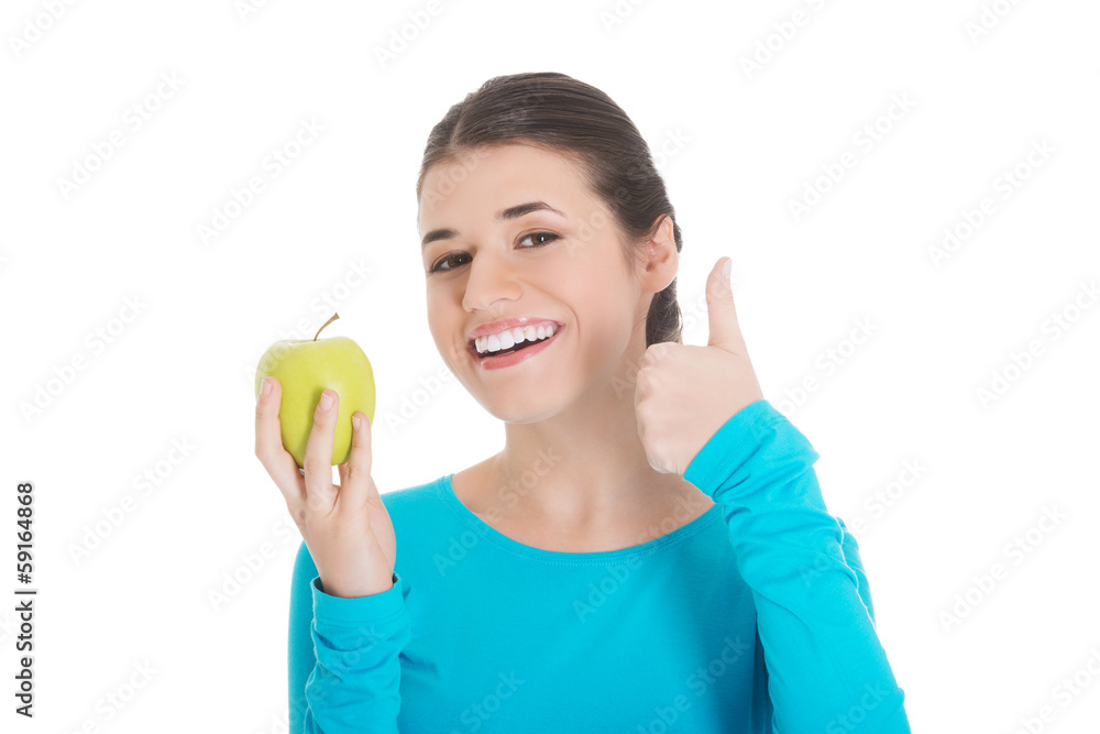 Portrait of a beautiful woman showing ok with apple. Portrait of a beautiful woman showing ok with apple.