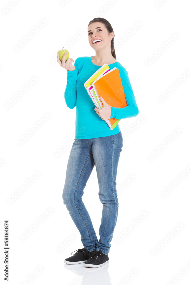 Beautiful young student with files and apple. Beautiful young student with files and apple.