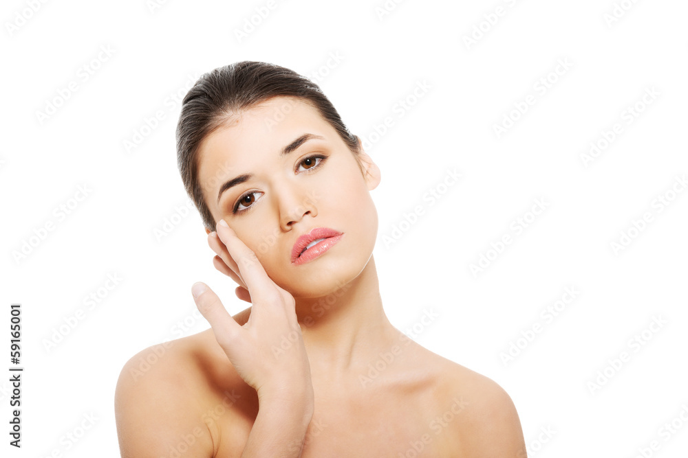 Portrait of beautiful topless woman touching her face. Portrait of beautiful topless woman touching her face.