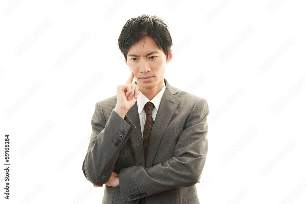 悩むビジネスマン 悩むビジネスマン