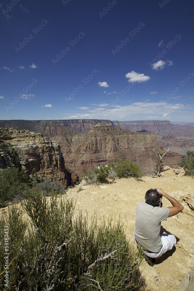 homme photographiant  le Grand Canyon, Arizona