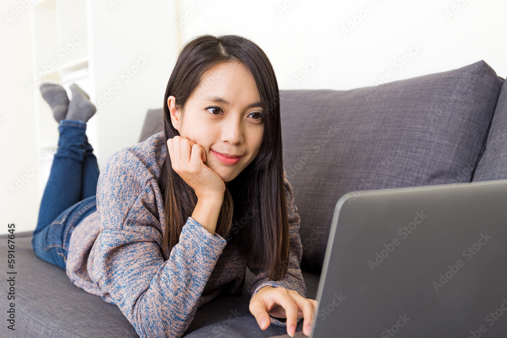 Asian woman looking at computer screen Asian woman looking at computer screen