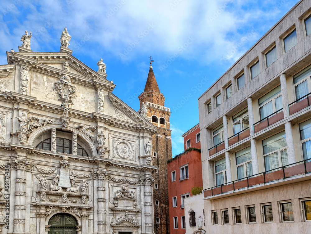 Church and modern building in Venice, Italy.