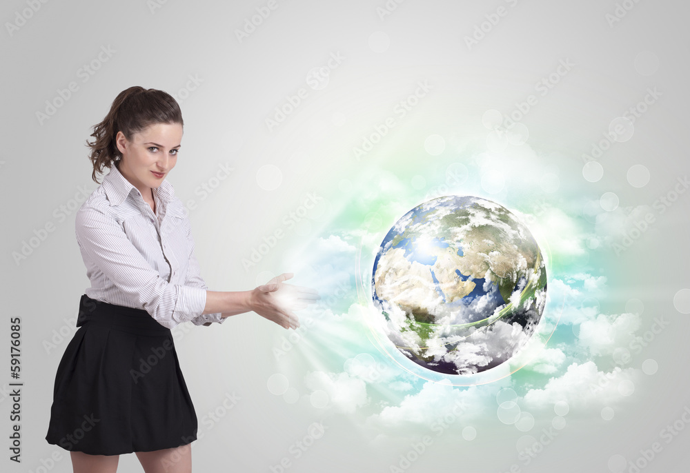 Fototapeta premium Young woman with earth and cloud concept