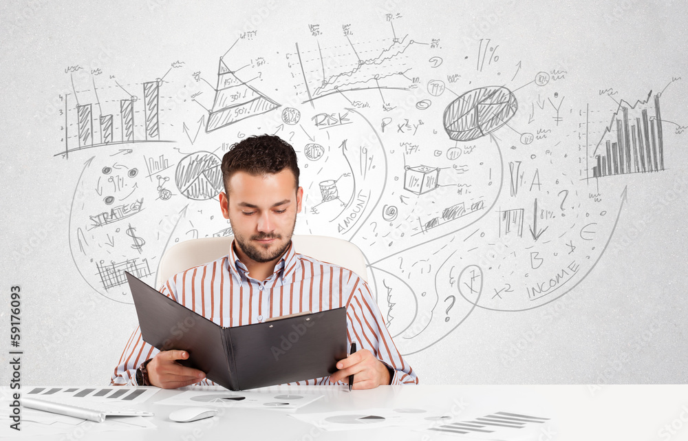 Business man at desk with hand drawn charts Business man at desk with hand drawn charts