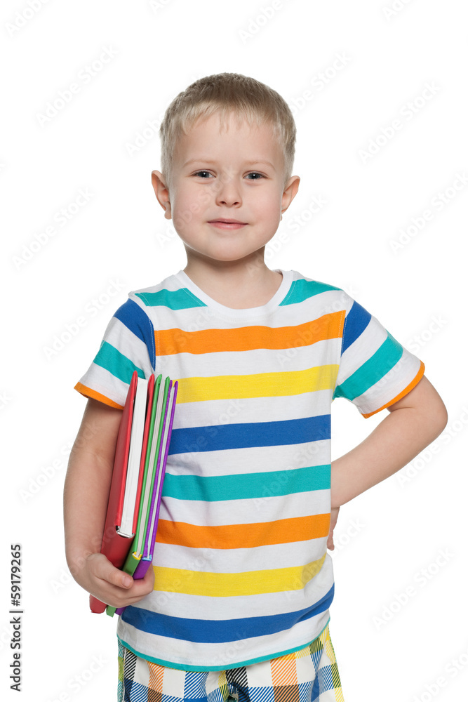 Young boy in striped shirt with books Young boy in striped shirt with books