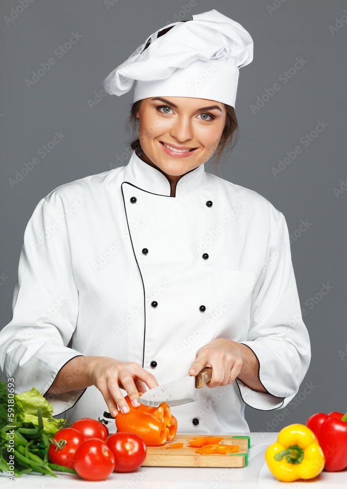 Beautiful young woman cook cutting vegetables Beautiful young woman cook cutting vegetables