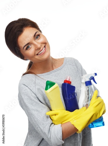 Beautiful woman in gloves holding different cleaning stuff
