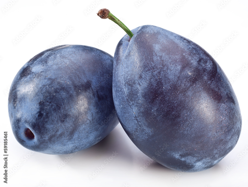 Obraz premium Photo of two plums.