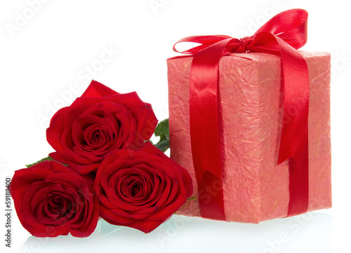 Gift and three red rose close up