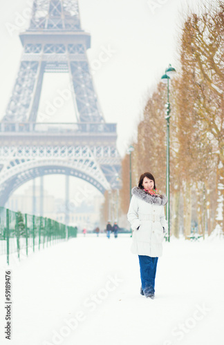 Girl walking in Paris on a snow day © Ekaterina Pokrovsky