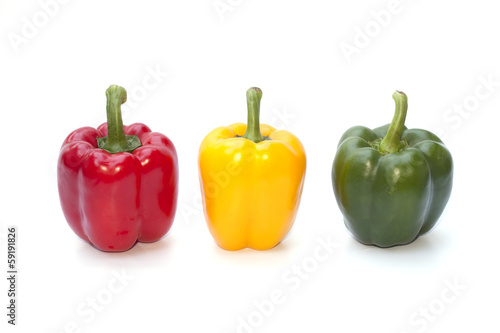 Red, yellow and green bell peppers isolated