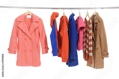 female coat clothing on hangers at the show