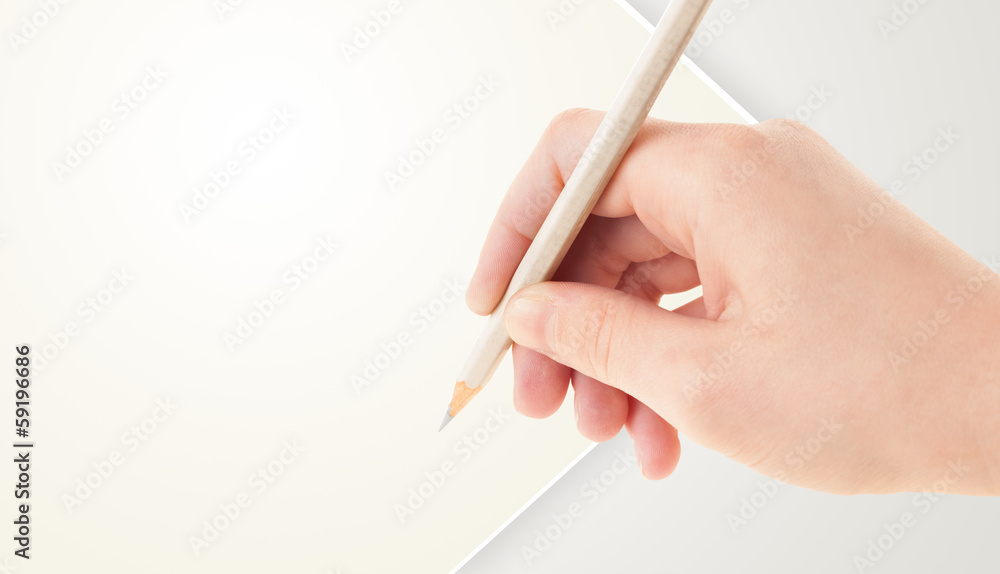 Human hand drawing with pencil on empty paper template Human hand drawing with pencil on empty paper template