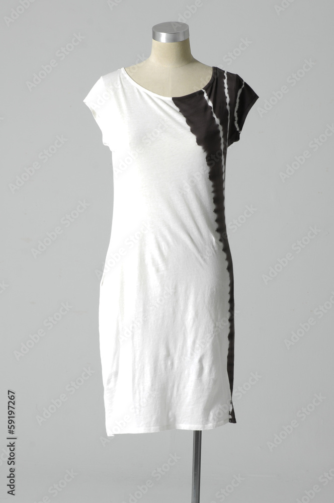 Mannequin dressed in sundress on gray background Mannequin dressed in sundress on gray background