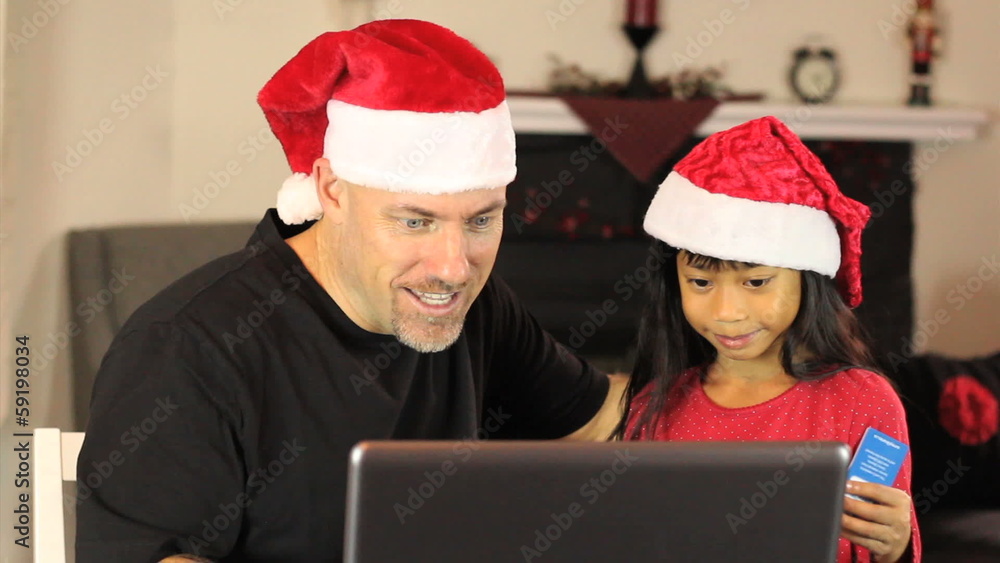 Excited Online Christmas Shoppers Using Laptop Excited Online Christmas Shoppers Using Laptop