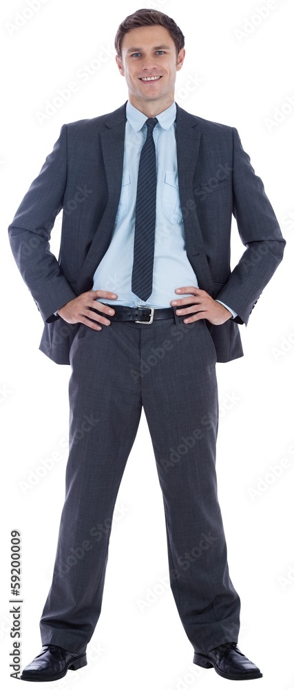 Smiling businessman with hands on hips Smiling businessman with hands on hips